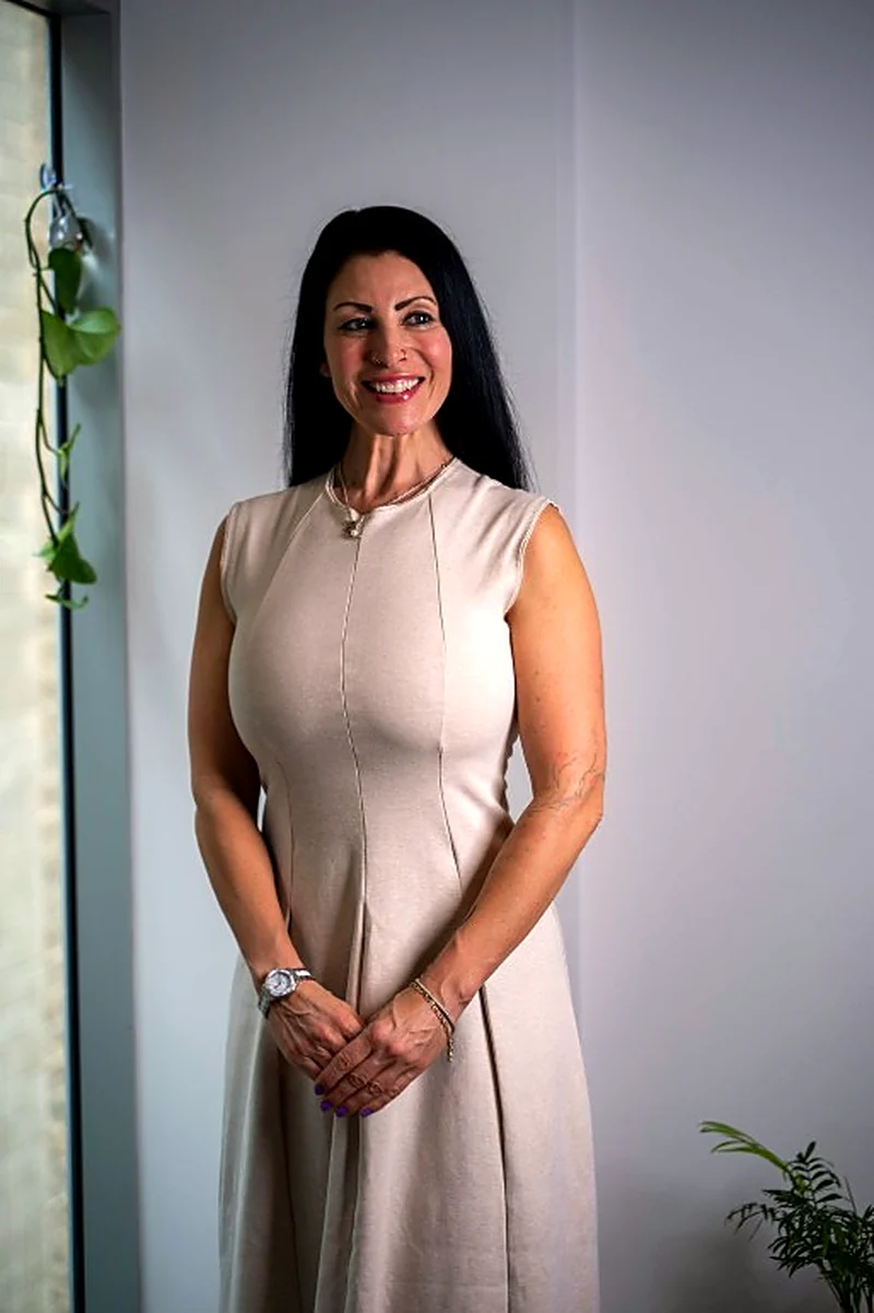 Janina, Director of Clarity Property Services, in a warm neutral dress
